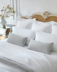 Ravello Coverlet and Lumbar dec pillows in the color cove paired with Alesandra Sheeting in white