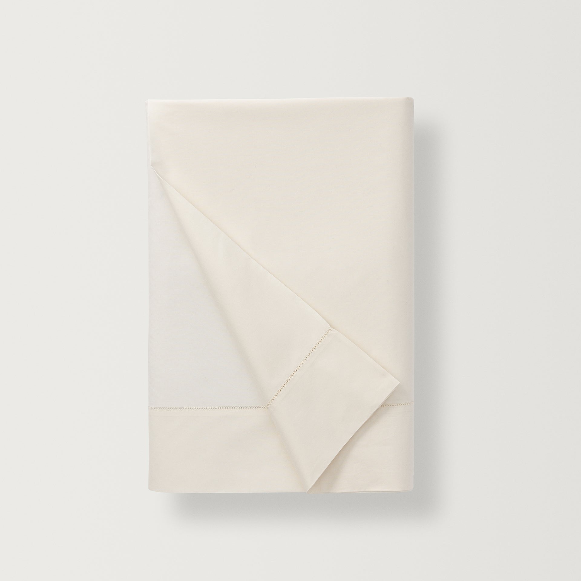 500 thread count, 100% long staple  cotton percale flat sheet with a hemstitch border in the color ivory