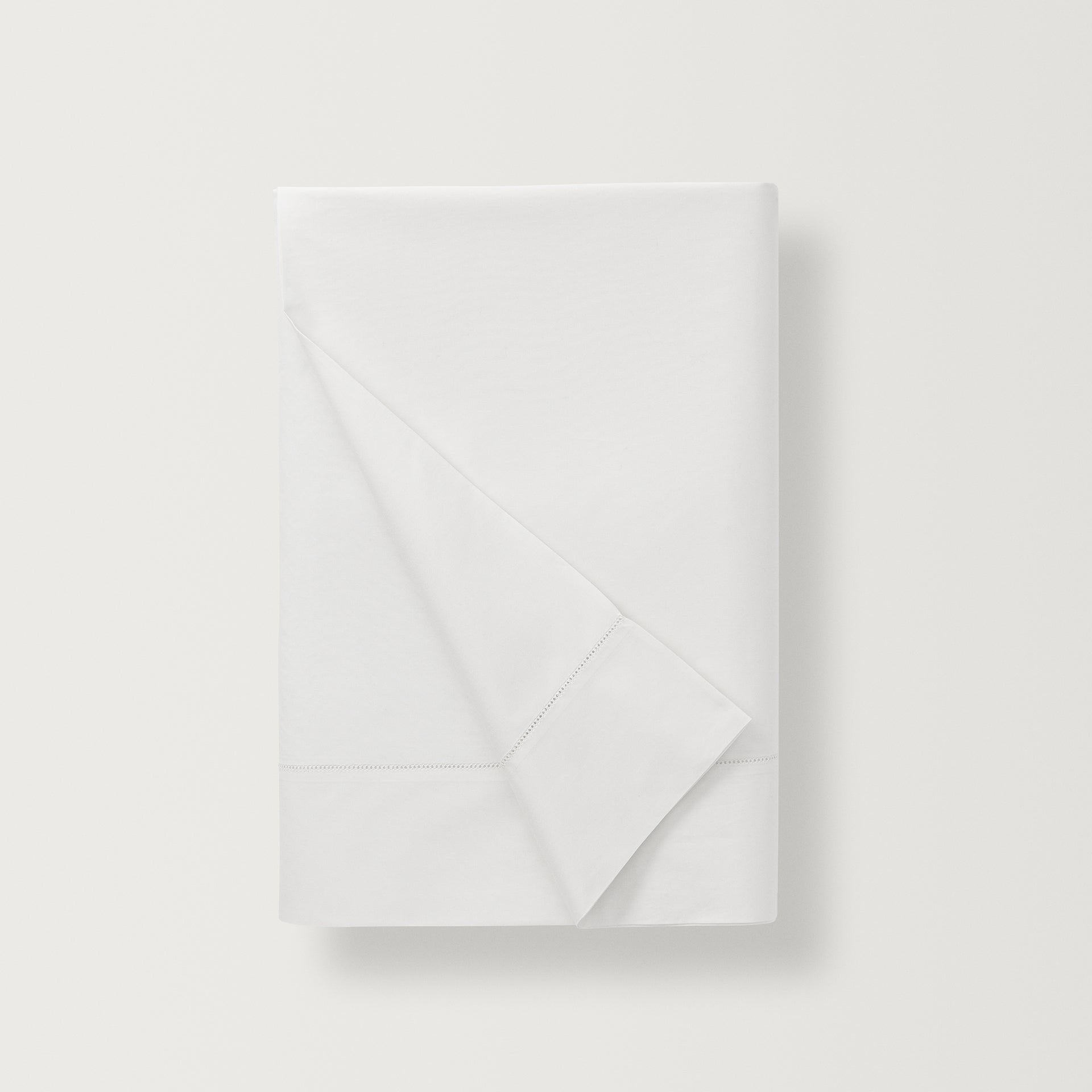 500 thread count, 100% long staple  cotton percale flat sheet with a hemstitch border in the color white