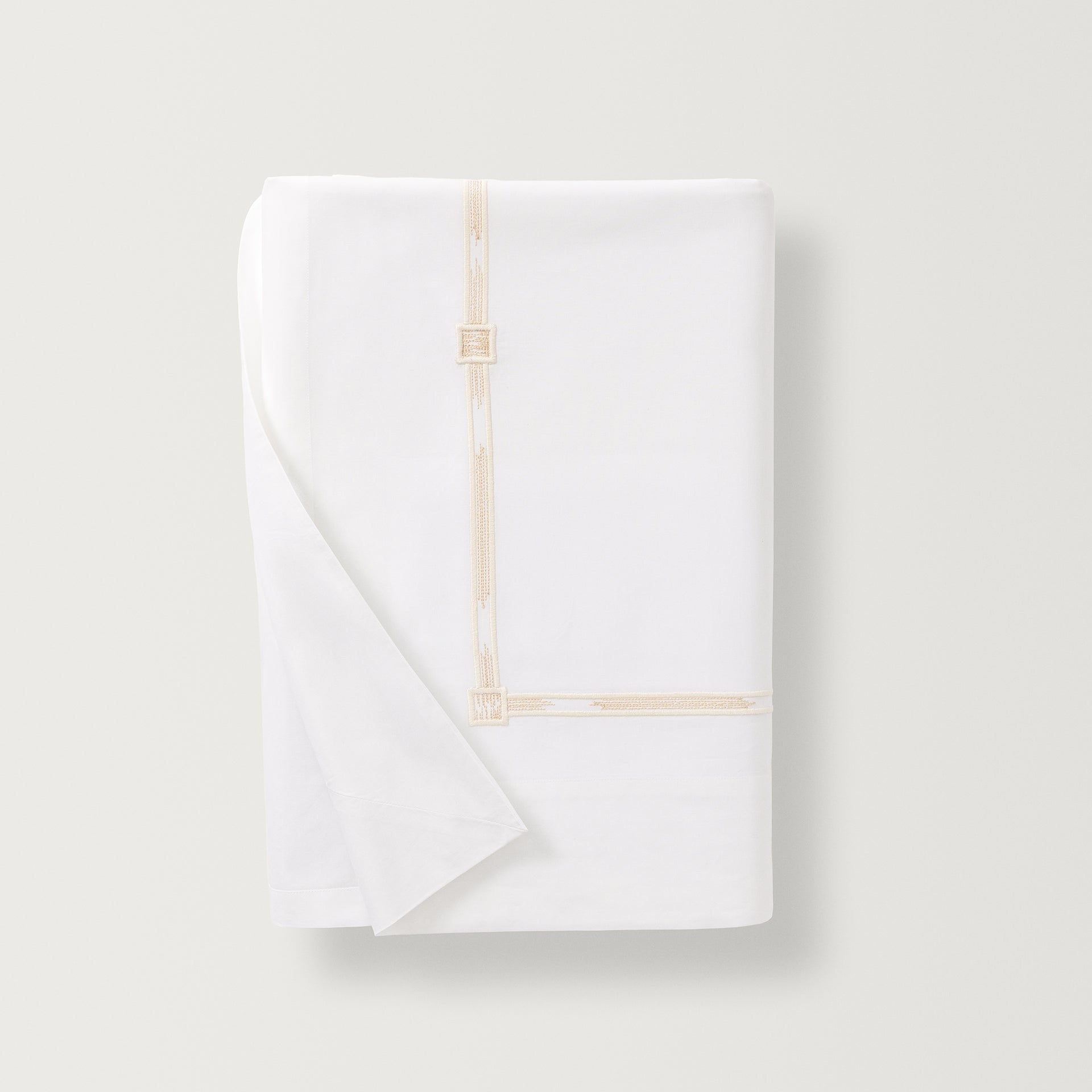Lisetta Flat sheet with close up detail of the embroidery pattern in the color champagne