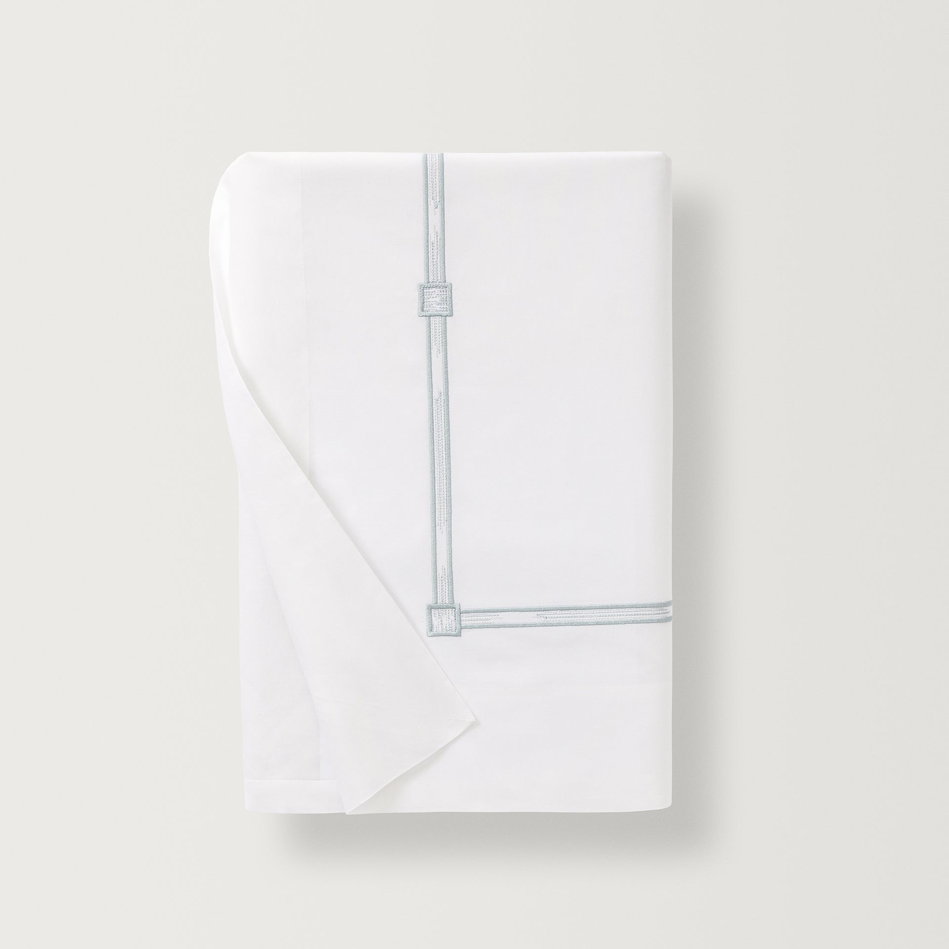 Lisetta Flat sheet with close up detail of the embroidery pattern in the color champagne