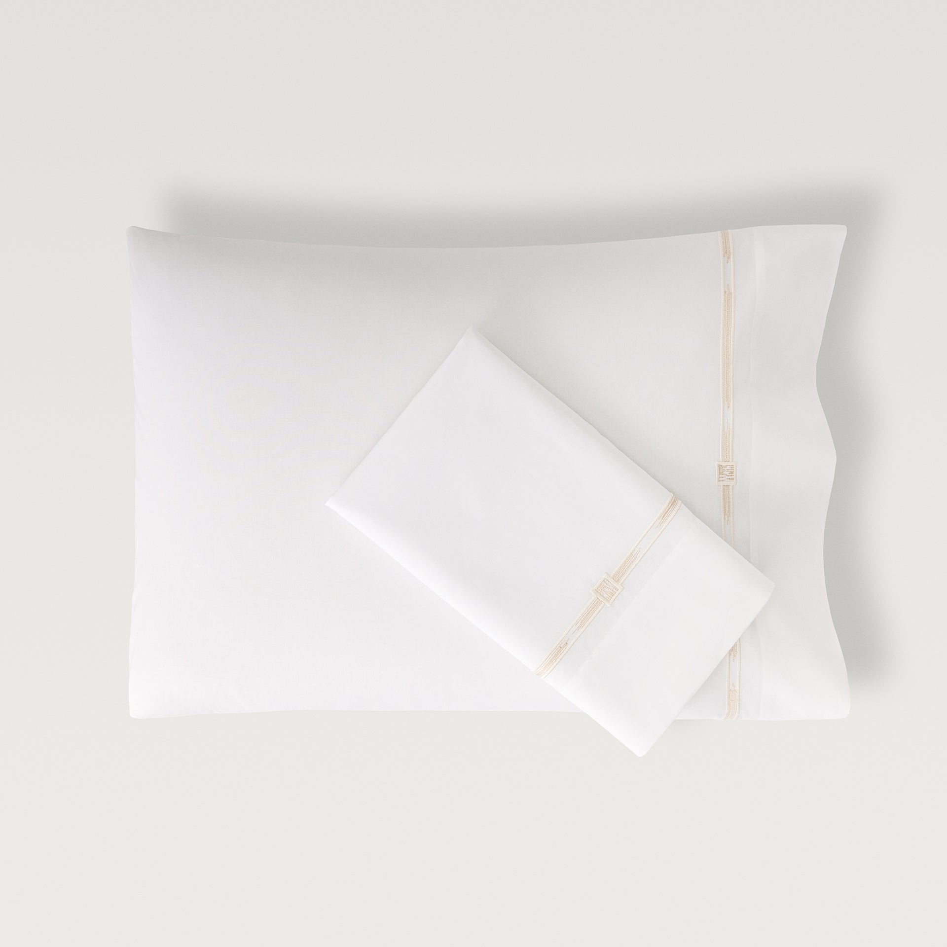 Lisetta Pillowcase with close up detail of embroidery pattern in the color champagne