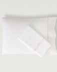 Lisetta Pillowcase with close up detail of embroidery pattern in the color champagne