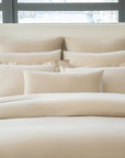Ravello Euro Shams and Lumbar Dec pillow in the color linen paired with Lucea Sea Island Fawn.