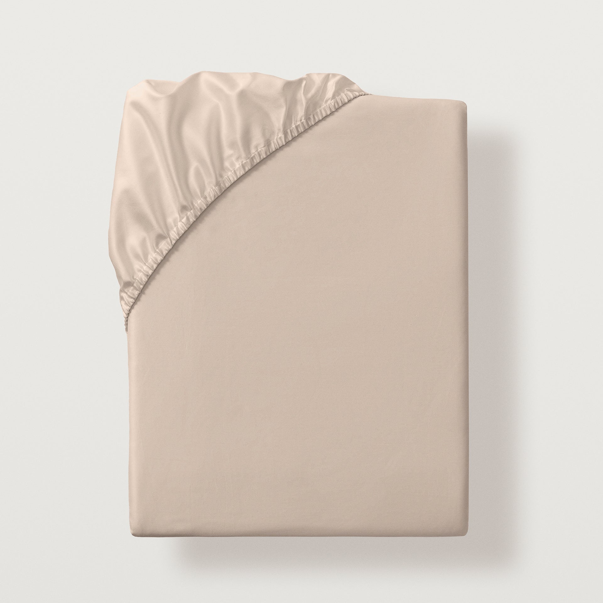 Lucea sea island cotton fitted sheet with all around elastic skirt. Fits mattresses up to 17" deep #color_fawn