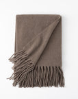 Pietro lambswool throw in the color truffle,