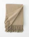 Pietro lambswool throw in the color nougat,