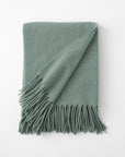 Pietro lambswool throw in the color lichen,