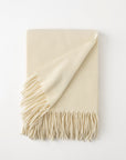 Pietro lambswool throw in the color ivory,