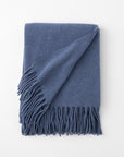 Pietro lambswool throw in the color lake blue,