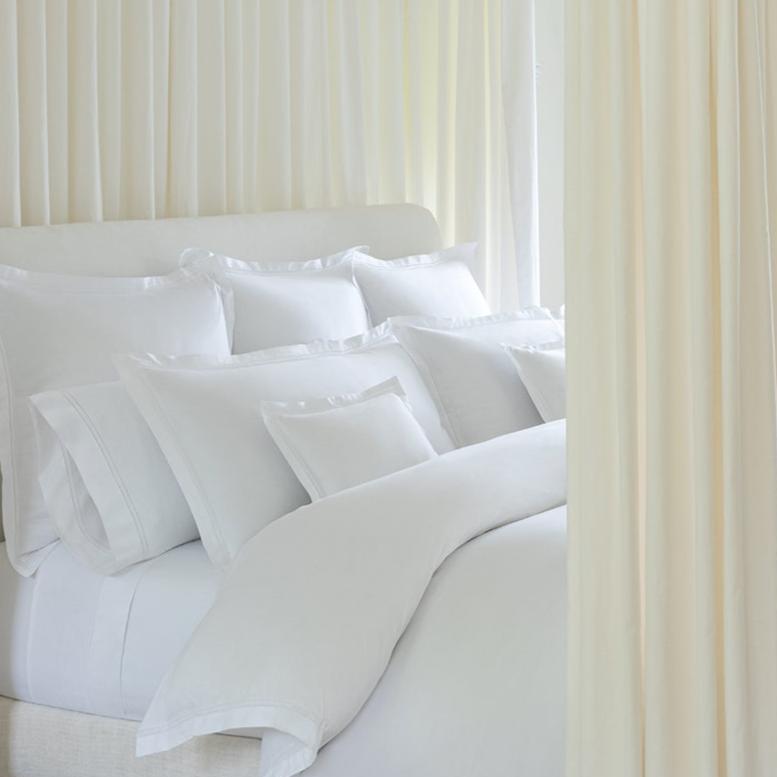 Detail shot of the Lucea Pillowcases and Shams in white