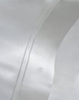 close up the double hemstitch detail of the Lucea Pillowcase in white and the monogram