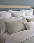 close up detail of Lucea's double hemstitch finish shams in white along side Ravello cove shams.