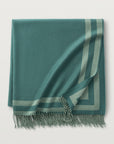 Our Carlyle Throw in the color jade is a beautiful reversible throw made of 70% Lambswool, 20% silk, 10% cashmere and Woven in Italy