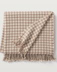 Our torcello throw is available in a beautiful houndstooth pattern in the color taupe. 70% Merino Wool, 30% Cashmere Handloomed in Nepal