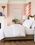 alesandra percale knife edge duvet cover in the color white features a button closure and ribbon ties inside each corner