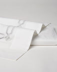 arezzo embroidered flat sheet in the color shadow & white. Pattern features 15" repeats,