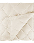 scandia home down blanket in the color ivory, folded