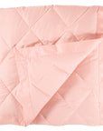 scandia home down blanket in the color petal, folded
