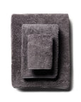 scandia home's indulgence wash, hand, and bath towel folded in the color charcoal