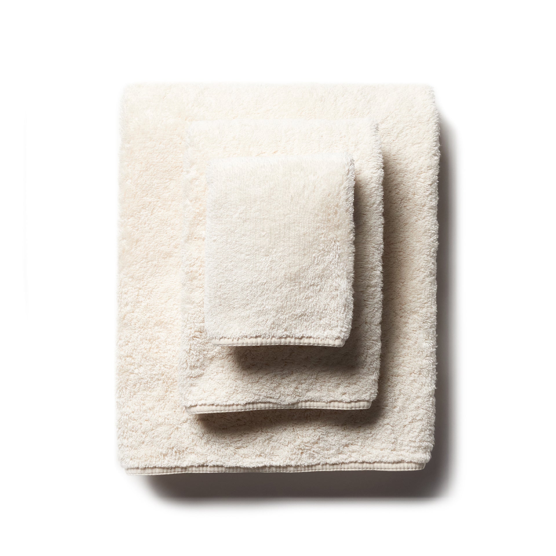 scandia home&#39;s indulgence wash, hand, and bath towel folded in the color ivory  