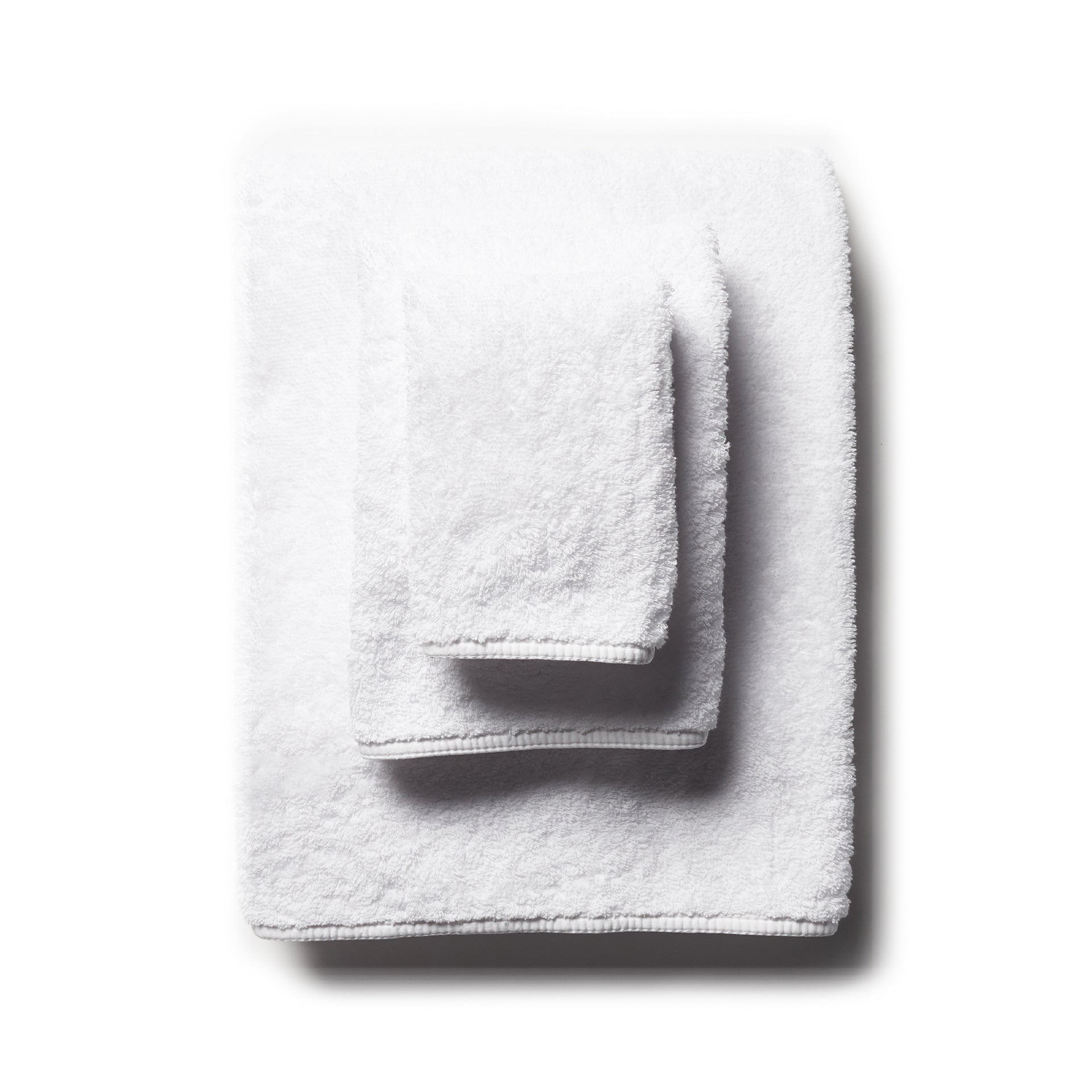 scandia home&#39;s indulgence wash, hand, and bath towel folded in the color white  