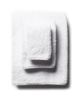 scandia home's indulgence wash, hand, and bath towel folded in the color white  