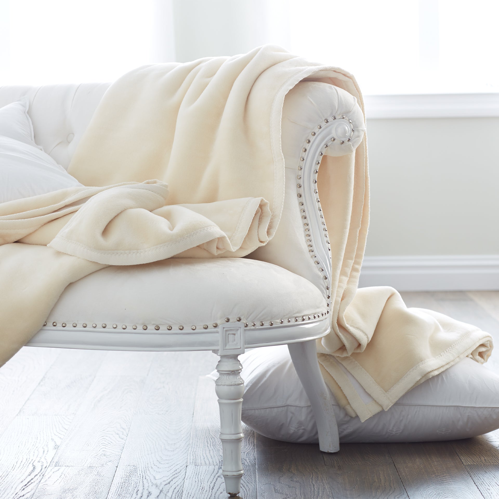 whether drapped across a sofa or folded at the foot of a bed, this plush cotton blanket adds the perfect touch of warmth, 