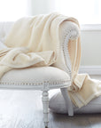 whether drapped across a sofa or folded at the foot of a bed, this plush cotton blanket adds the perfect touch of warmth,