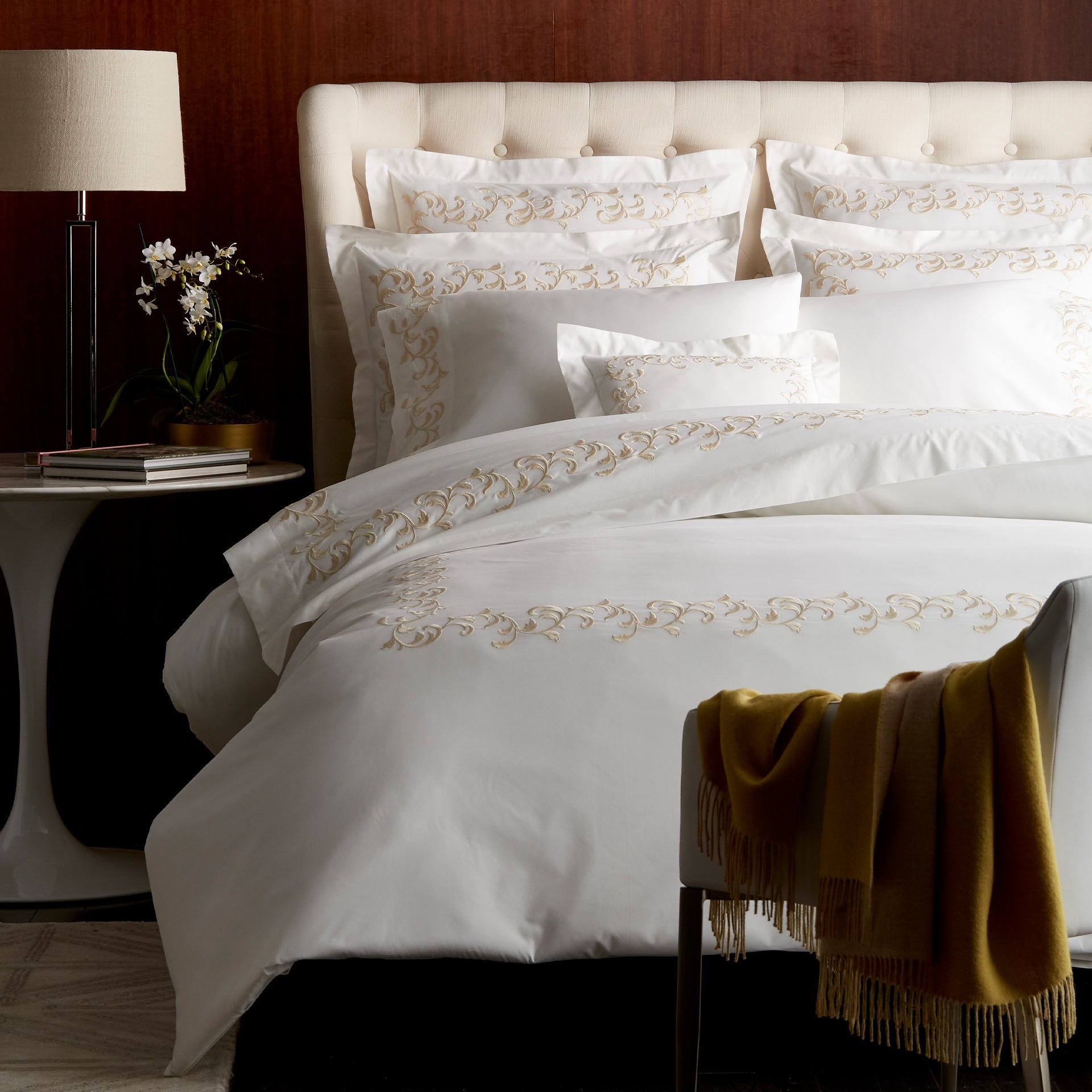 san remo duvet cover with scroll embroidered detail in color cornsilk & ivory. Knife edge design with button closure 