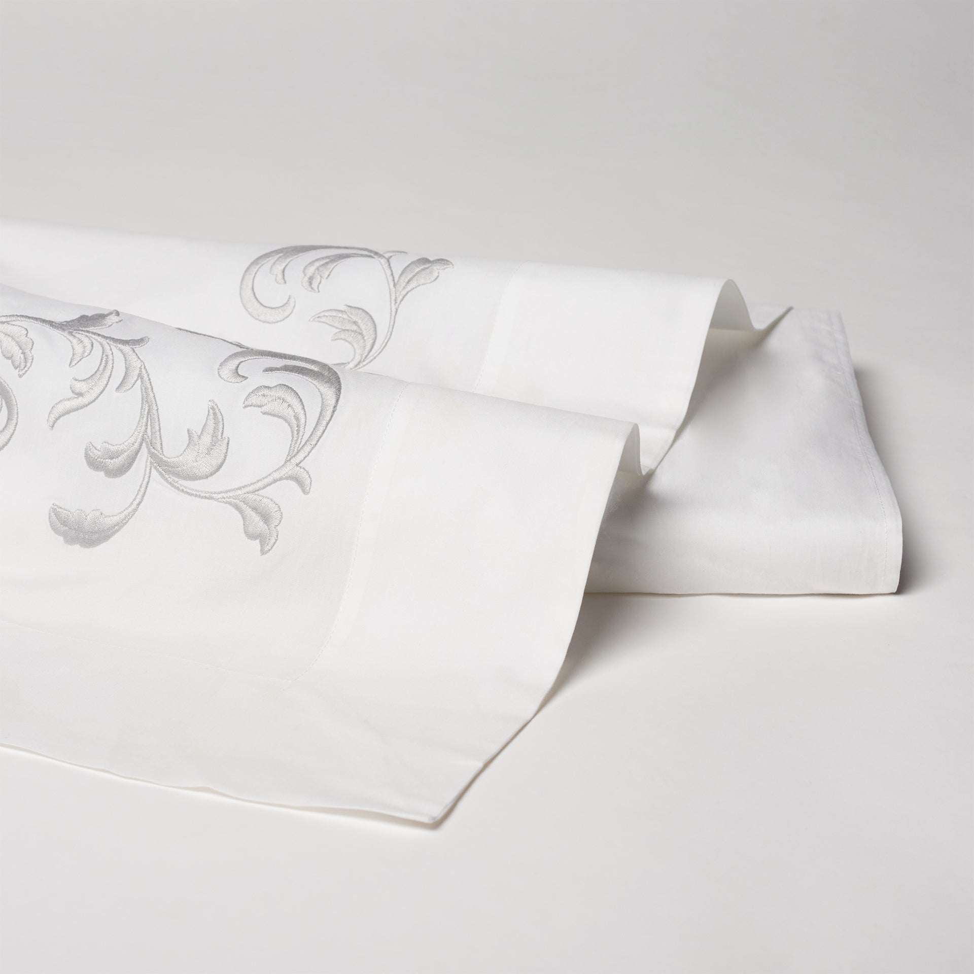san remo embroidered flat sheet in the color shadow &amp; white. Pattern features 15&quot; repeats, 