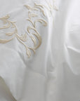 close up detail of san remo embroidered flat sheet in the color cornsilk and ivory, 