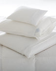 Stacked Scandia pillows covered with our 350 sateen pillow protector covers