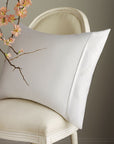 Pillow covered with our Sateen pillow protector, zipped closed showing Scandia Crest embroidery