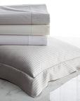 savoia flat sheets folded showing all available color ways-white, ivory, and shadow