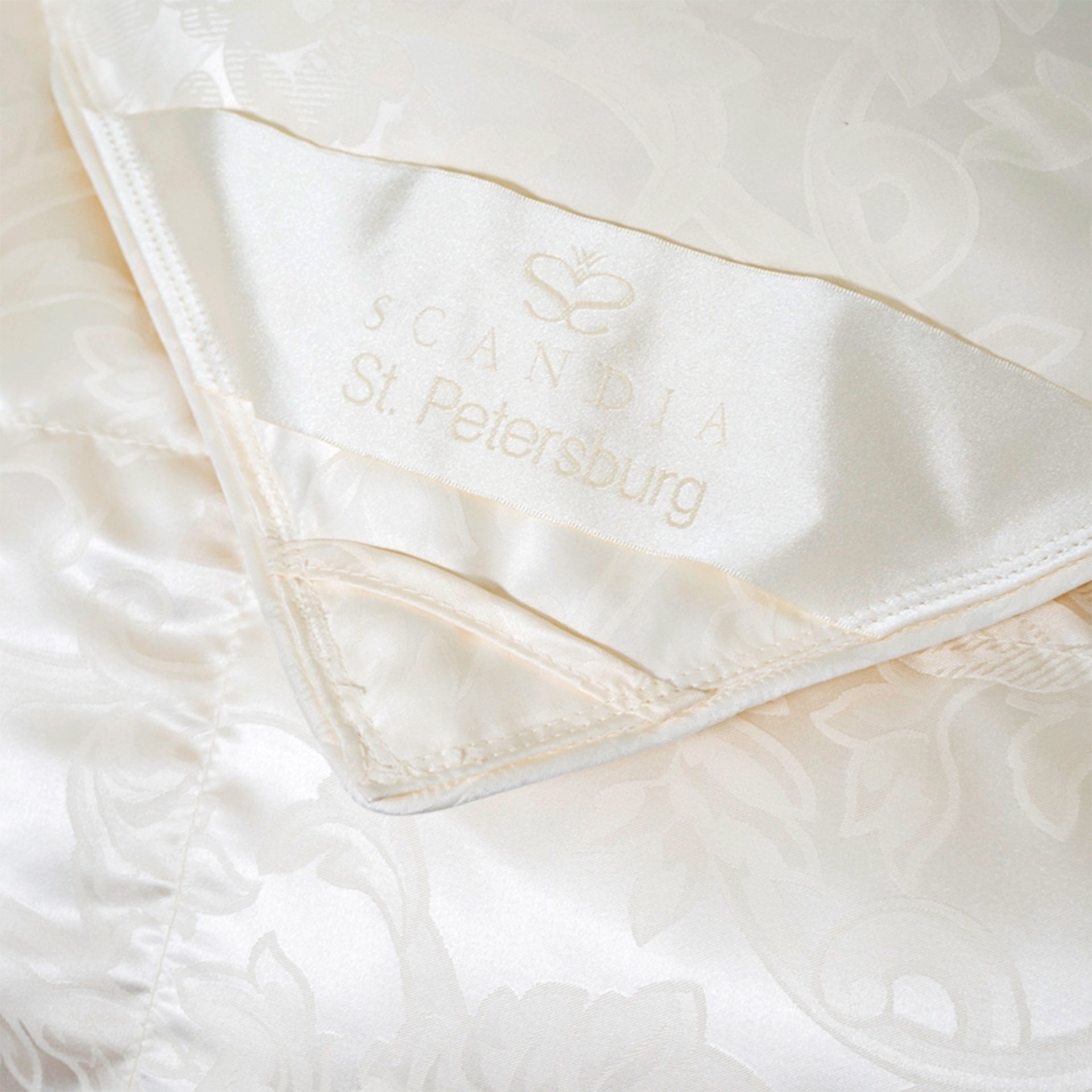 scandia home st.petersburg corner silk detail of stitching and fabric of the comforter
