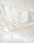 scandia home st.petersburg corner silk detail of stitching and fabric of the comforter