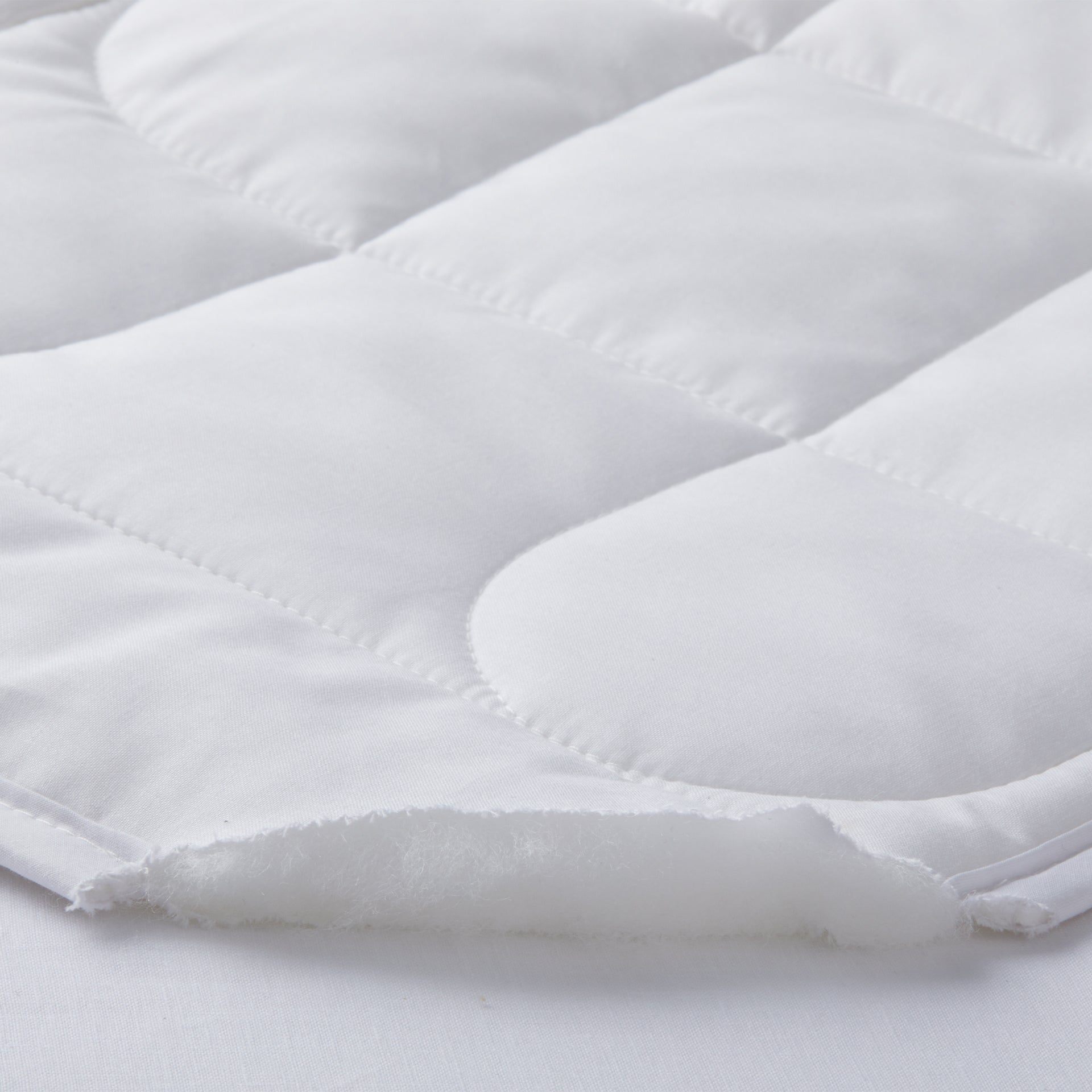 detail of the thermabalance mattress pad of 100% tencel fiber and a 100% cotton pad fabric shell outside