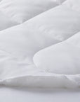 detail of the thermabalance mattress pad of 100% tencel fiber and a 100% cotton pad fabric shell outside