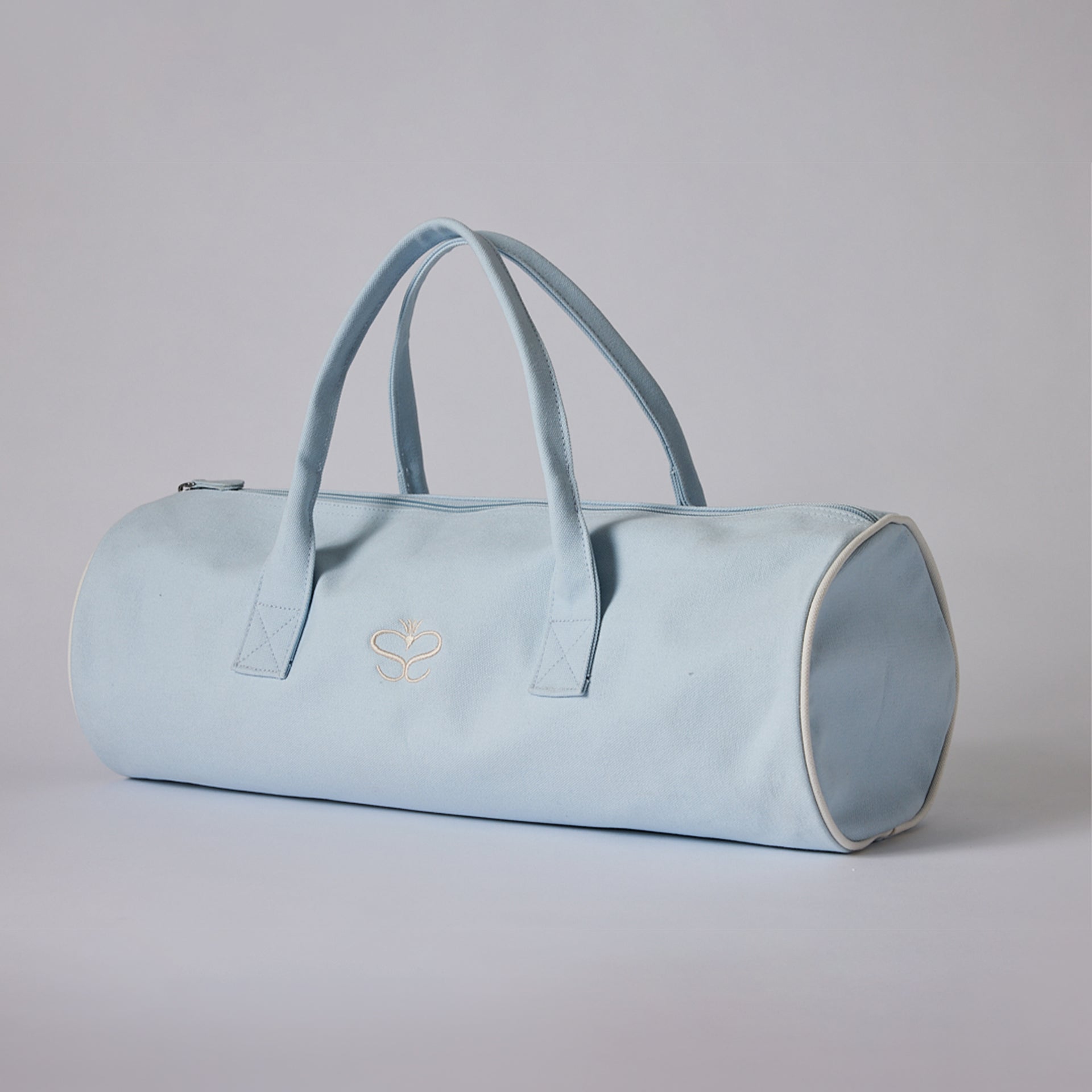 Down Alternative filled blanket 50 x 70" in this beautiful Sandia Home signature blue bag with monogram on the back:  Say Warm