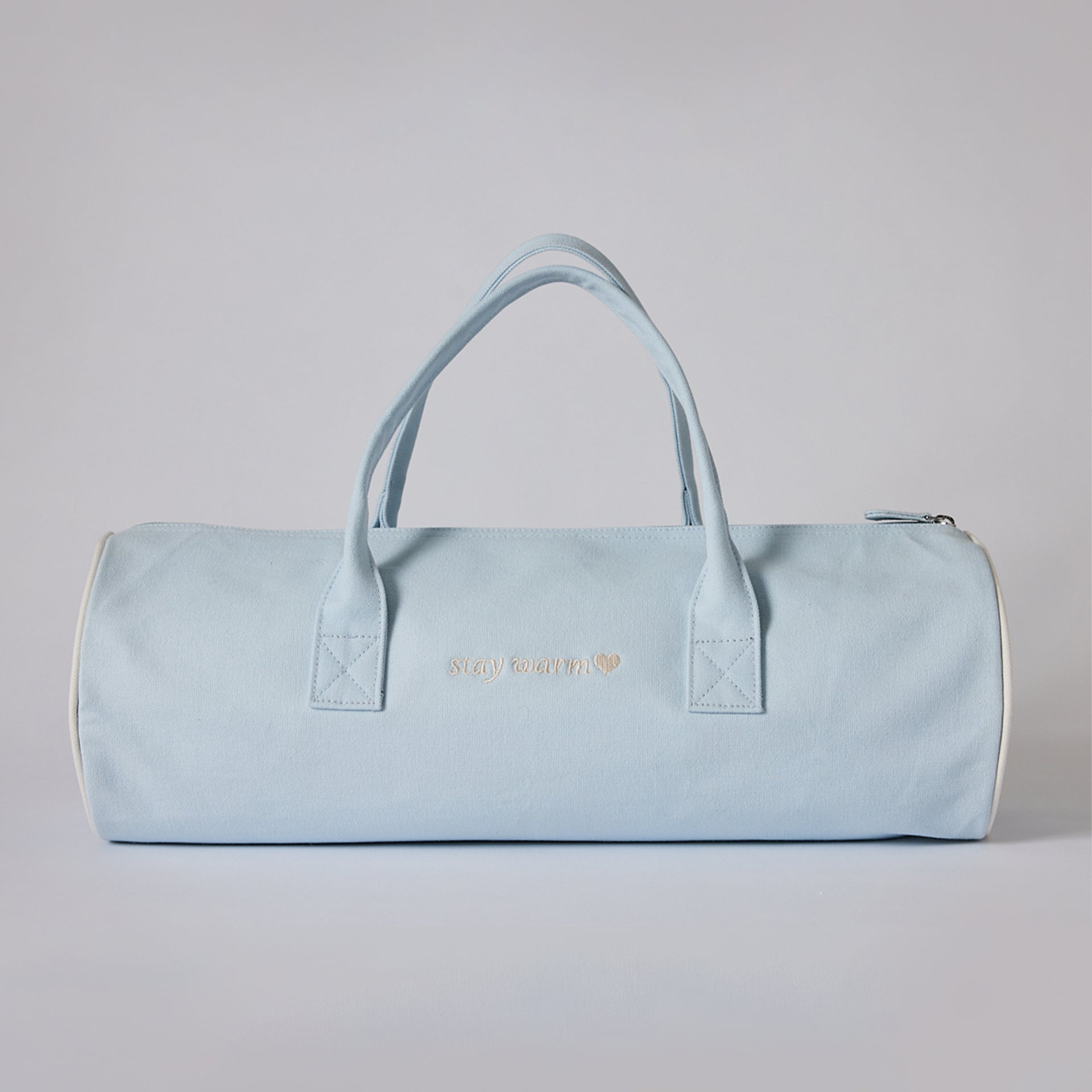 Down Alternative filled blanket 50 x 70" in this beautiful Sandia Home signature blue bag with monogram on the back:  Say Warm
