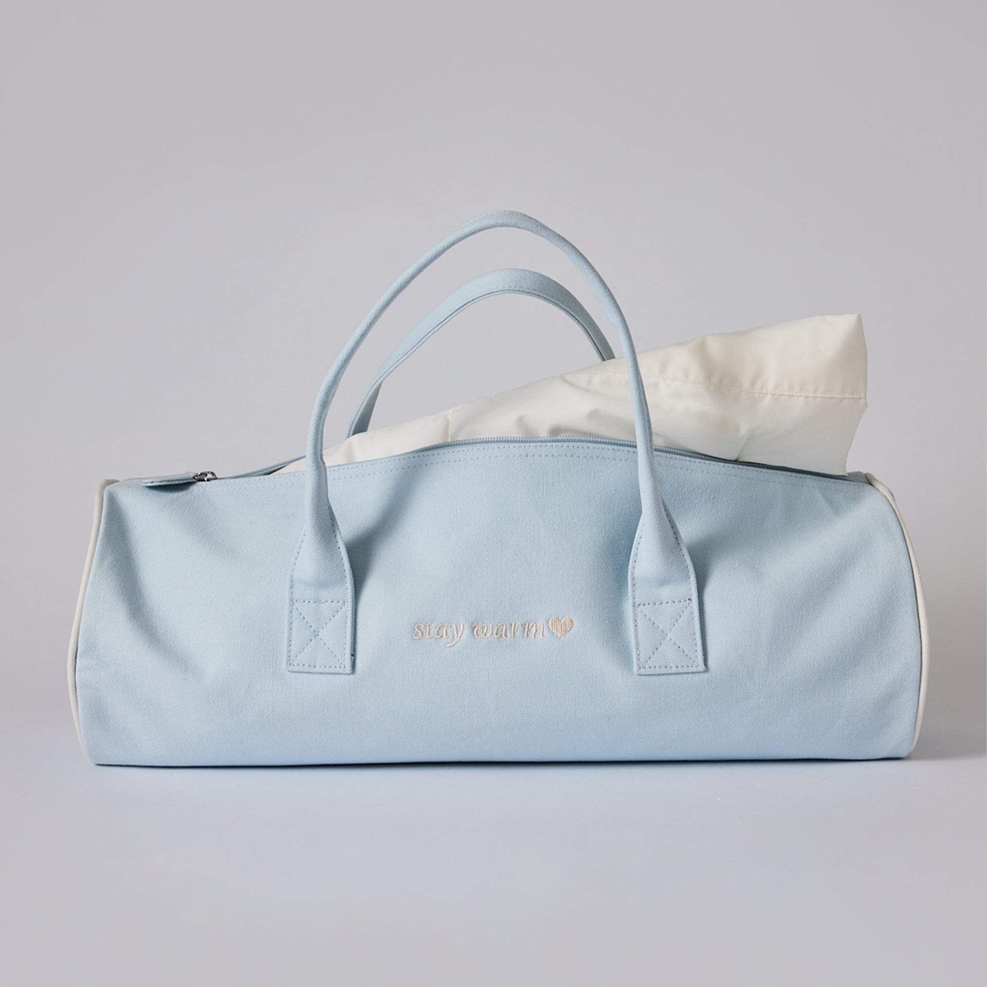 Down Alternative filled blanket 50 x 70" in this beautiful Sandia Home signature blue bag with monogram on the back:  Say Warm