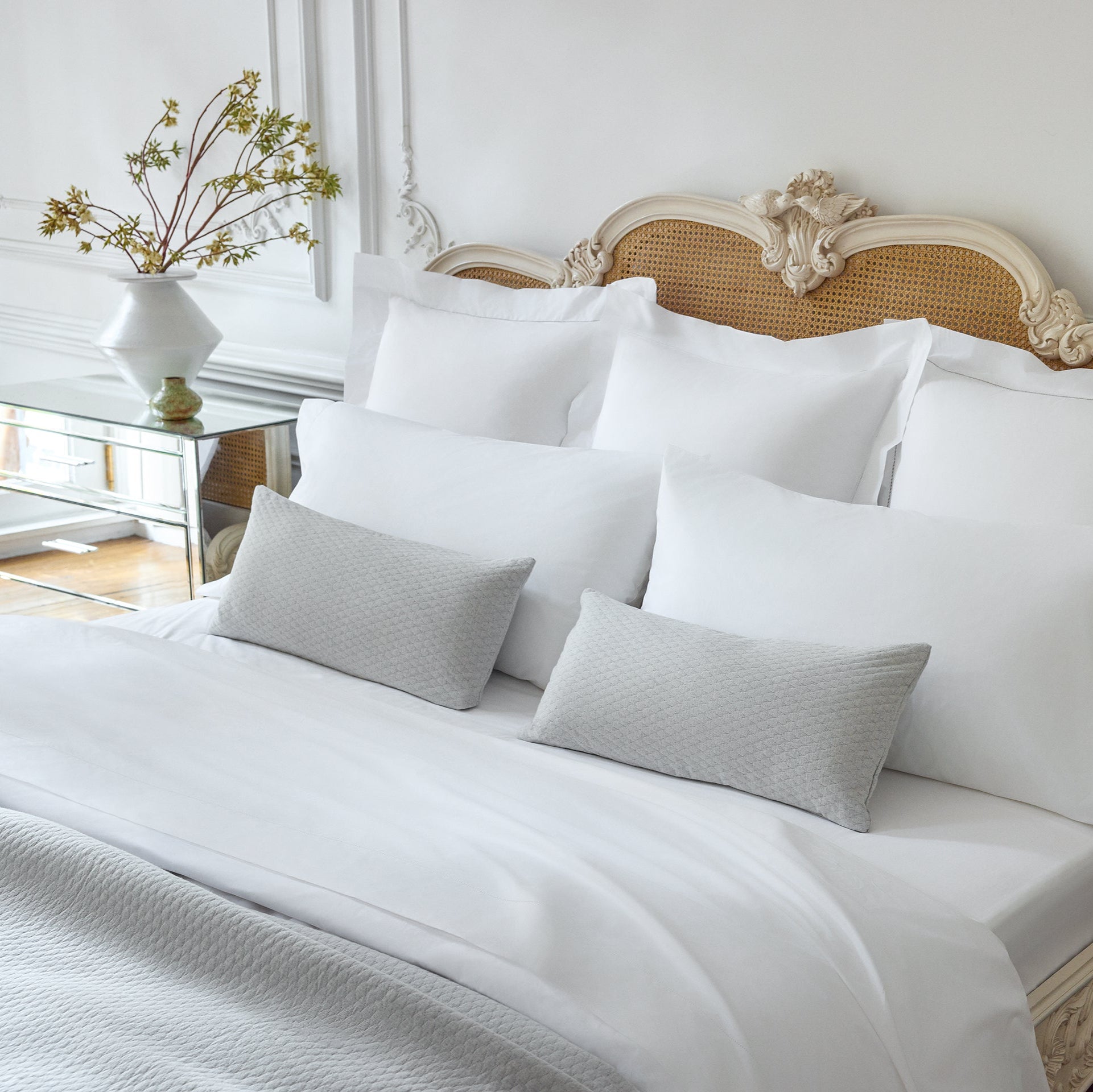 Ravello Coverlet and Lumbar dec pillows in the color cove paired with Alesandra Sheeting in white 
