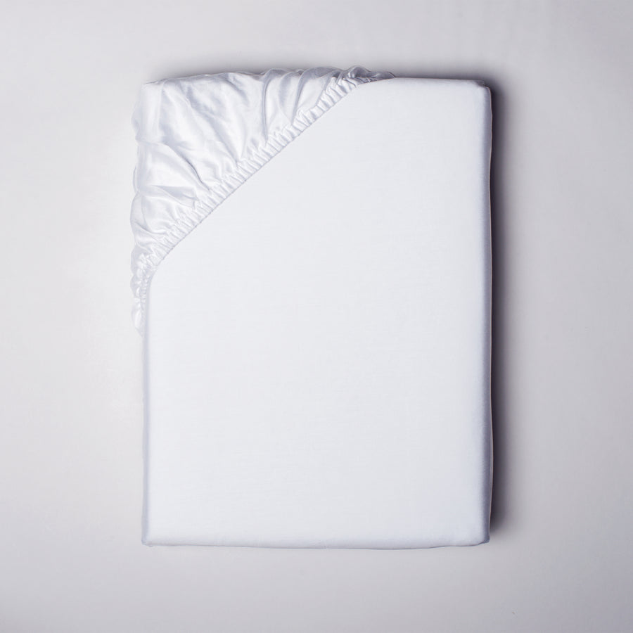 alesandra percale fitted sheet with all around sewen elastic skirt. Fits mattresses up to 17" deep
