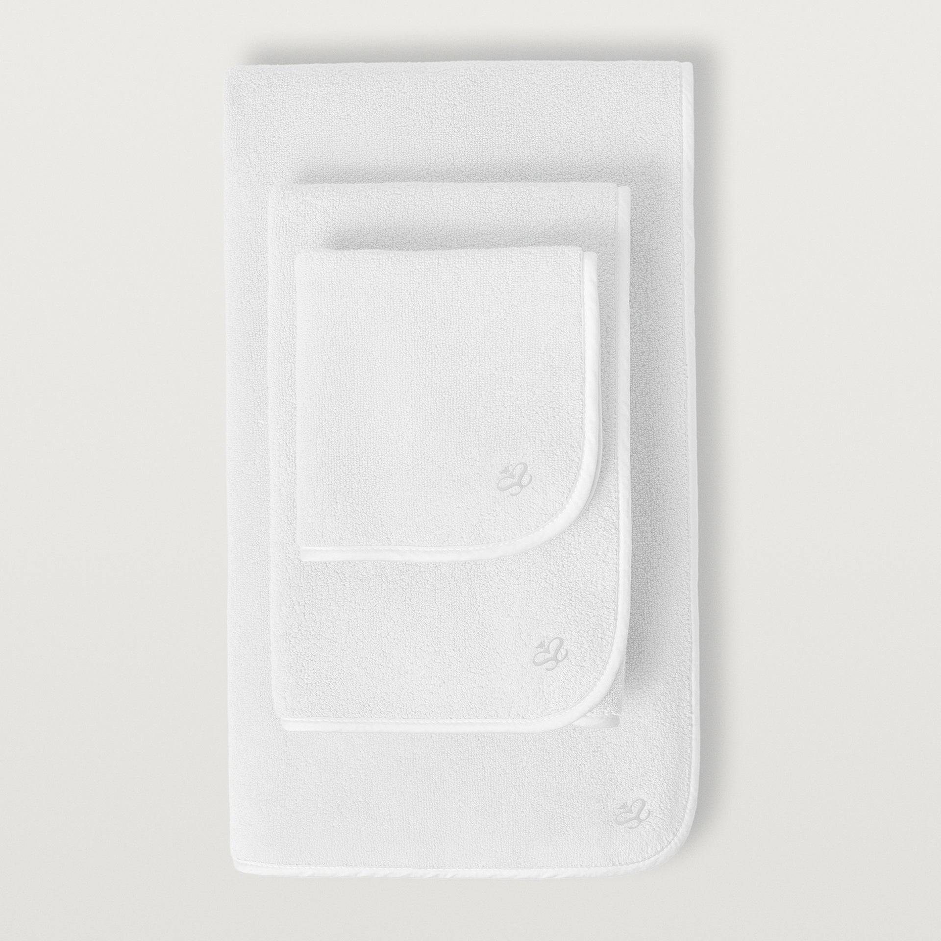 Delfine hand, wash, and bath towel in the color white #color_white
