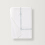 Lisetta Flat sheet with close up detail of the embroidery pattern in the color champagne