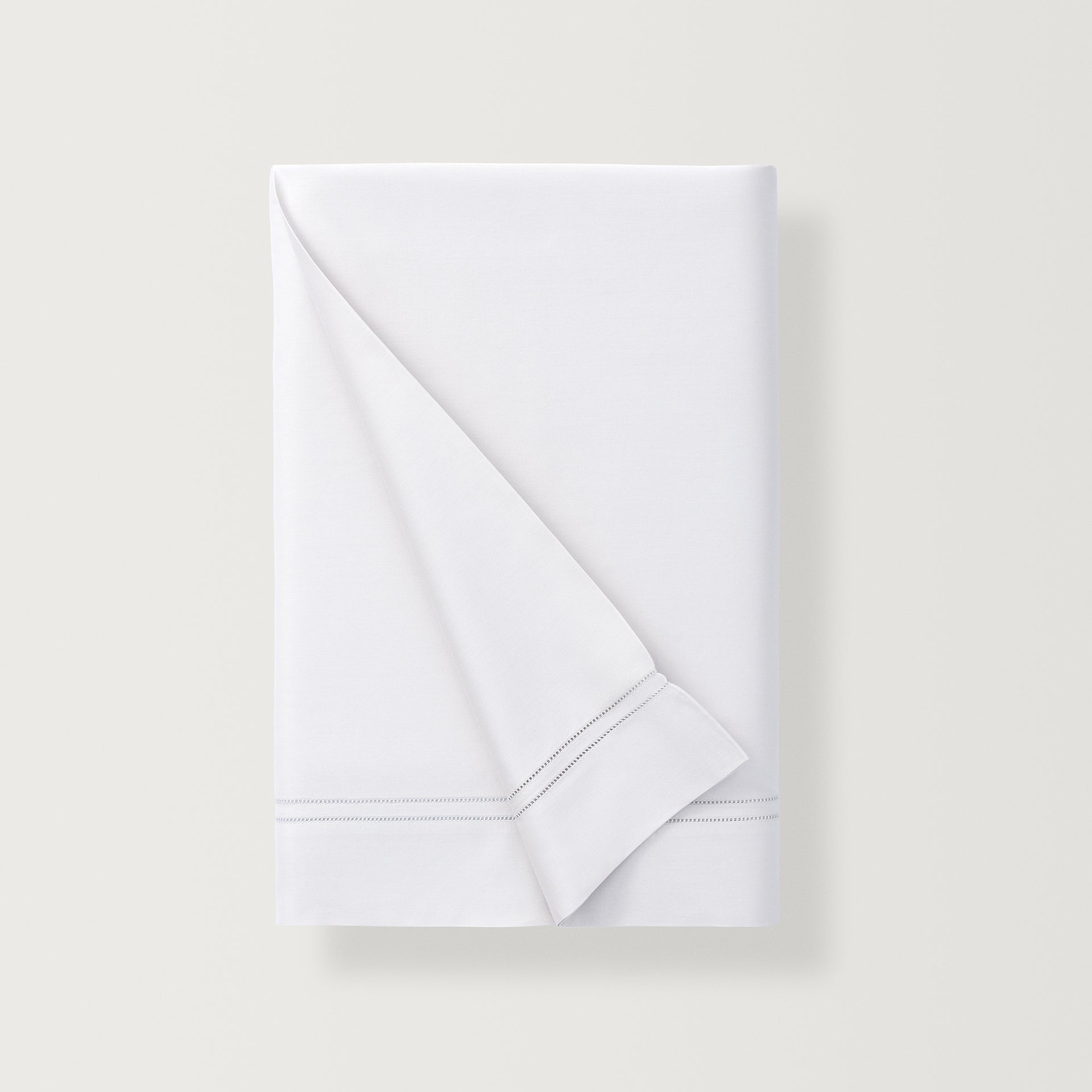 the flat sheet, finished with a double-row hemstitch, adds a touch of formal flair to the super-fine sateen, elevating both the look and feel of the sheet.
