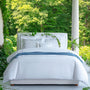 full bed shot of Lisetta Cloud paired with our San Remo in Cloud and our Carlotta cashmere throw in Aegean