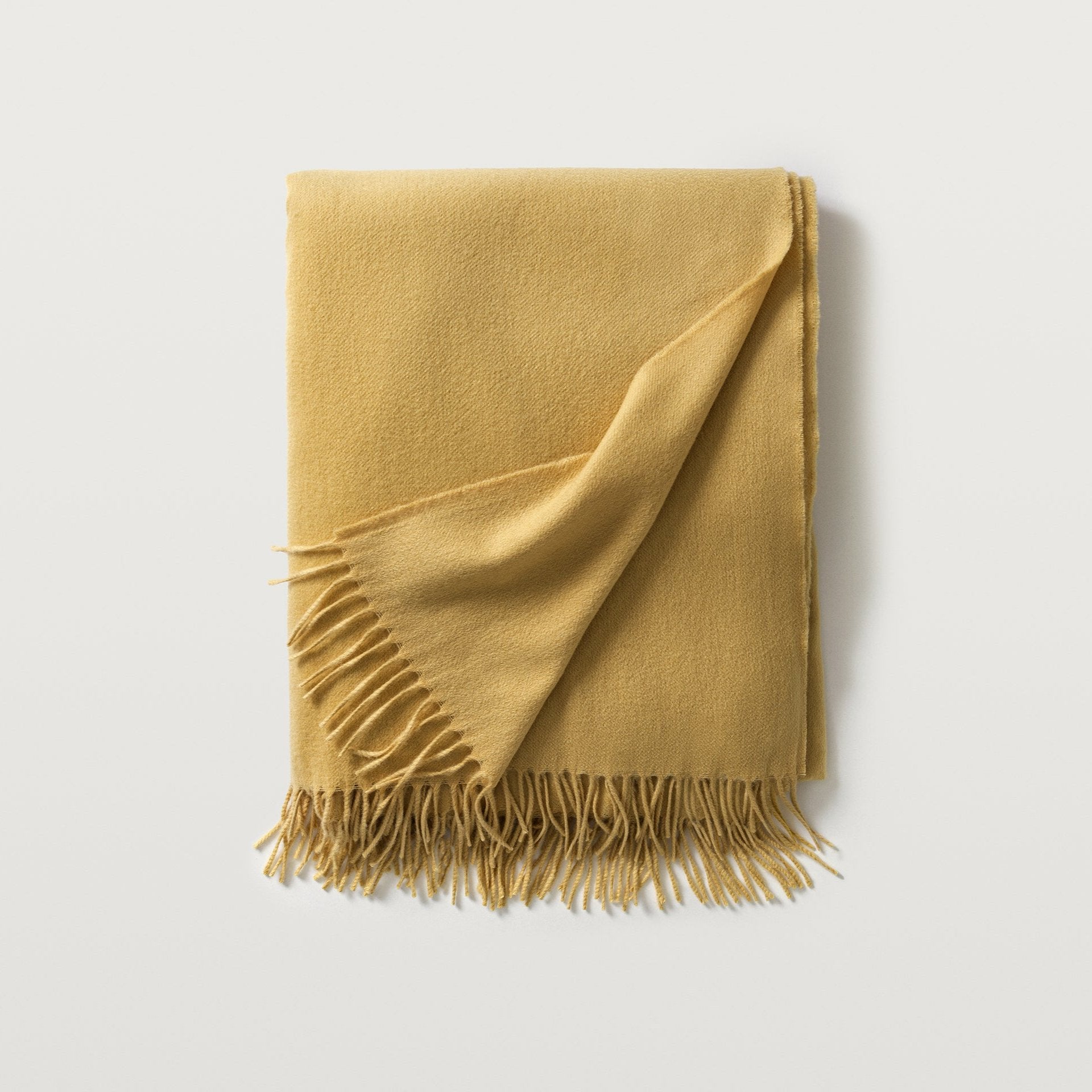 Carlotta throw in the color ochre, #color_ochre
