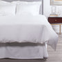 Alesandra percale knife edge duvet cover in the color white. Features a button closure and ribbon ties inside each corner